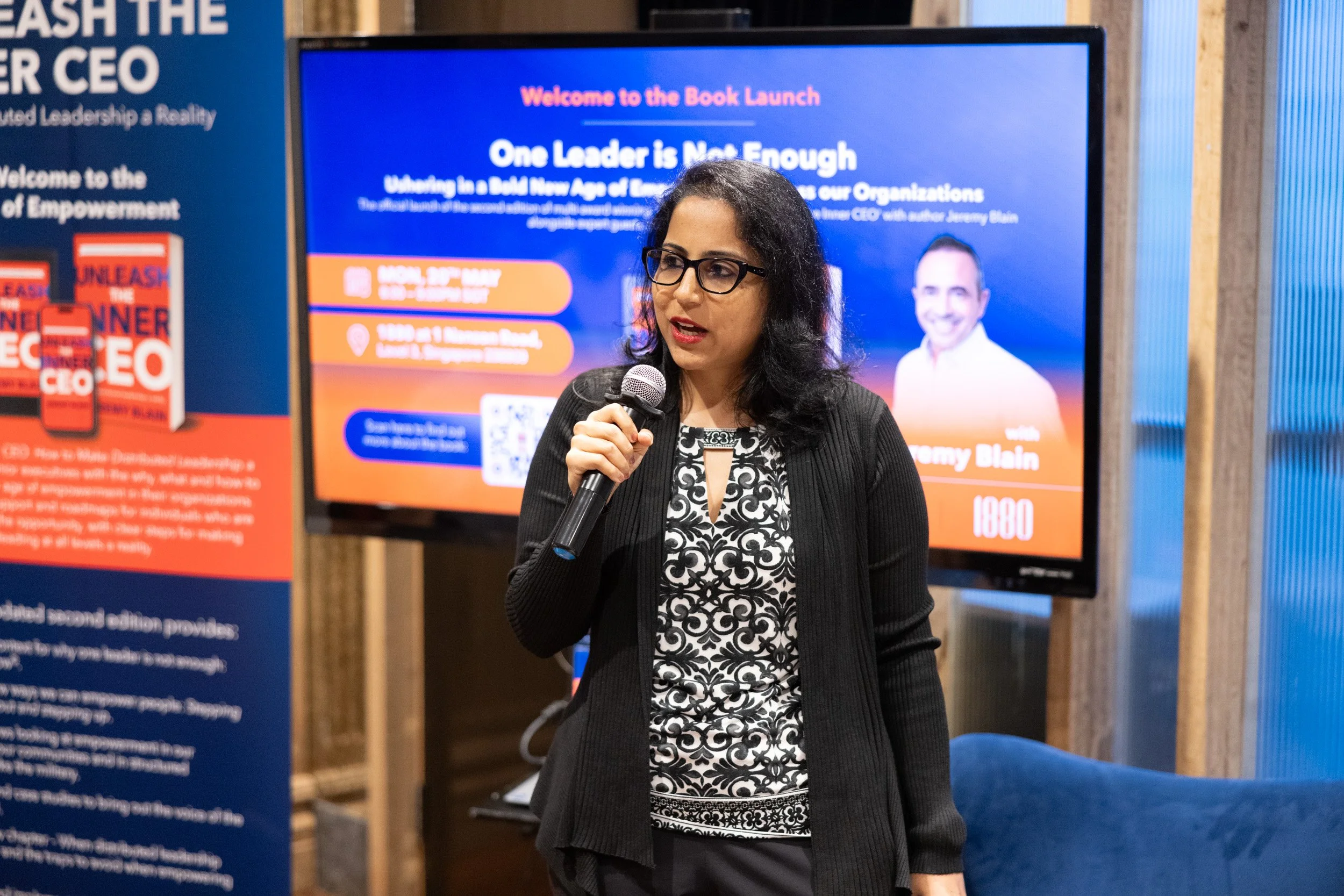  Close-up of moderator Neha Thakkar opening the book launch session at 1880 Singapore. 