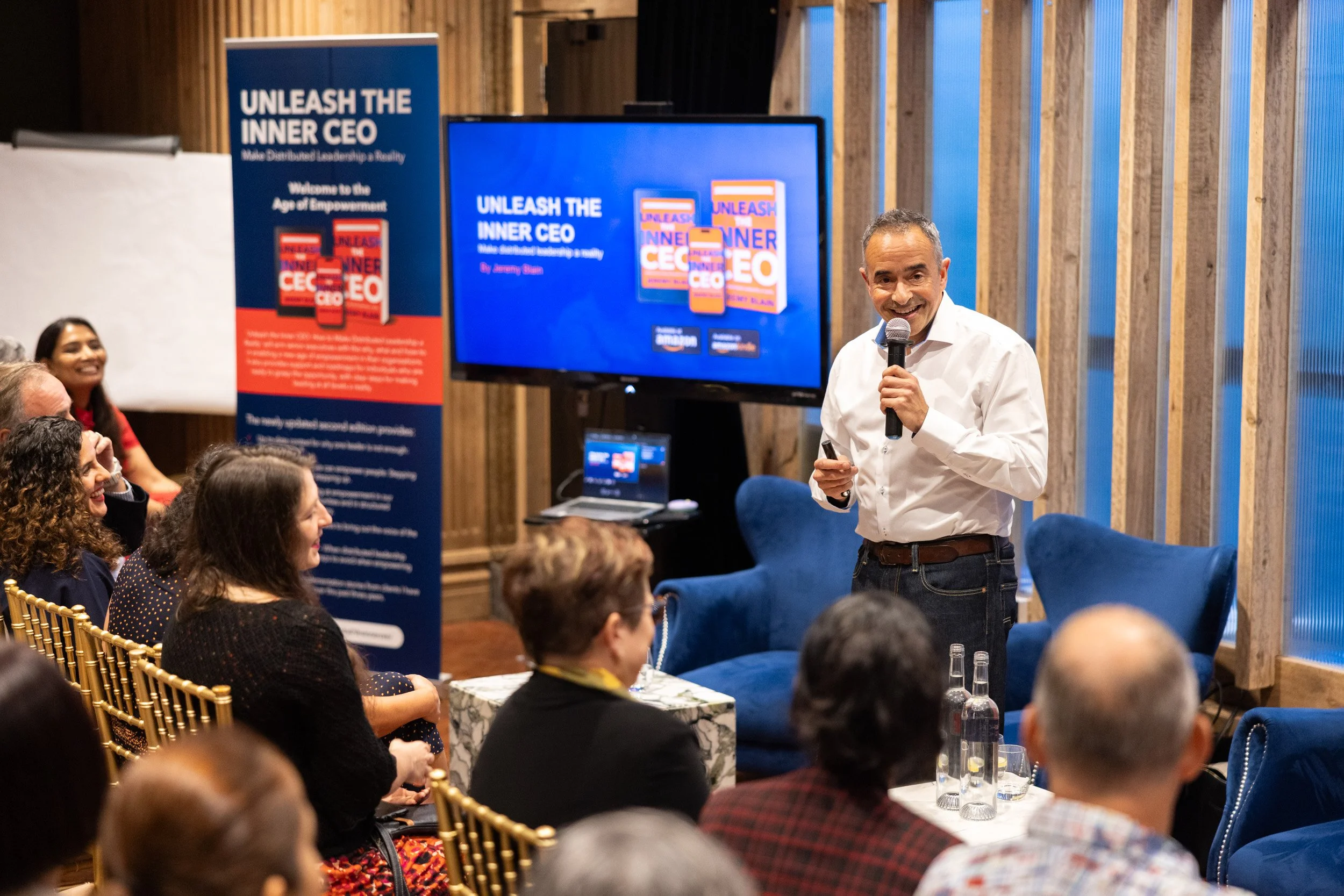  Medium perspective of author Jeremy Blain delivering his keynote presentation on distributed leadership. 