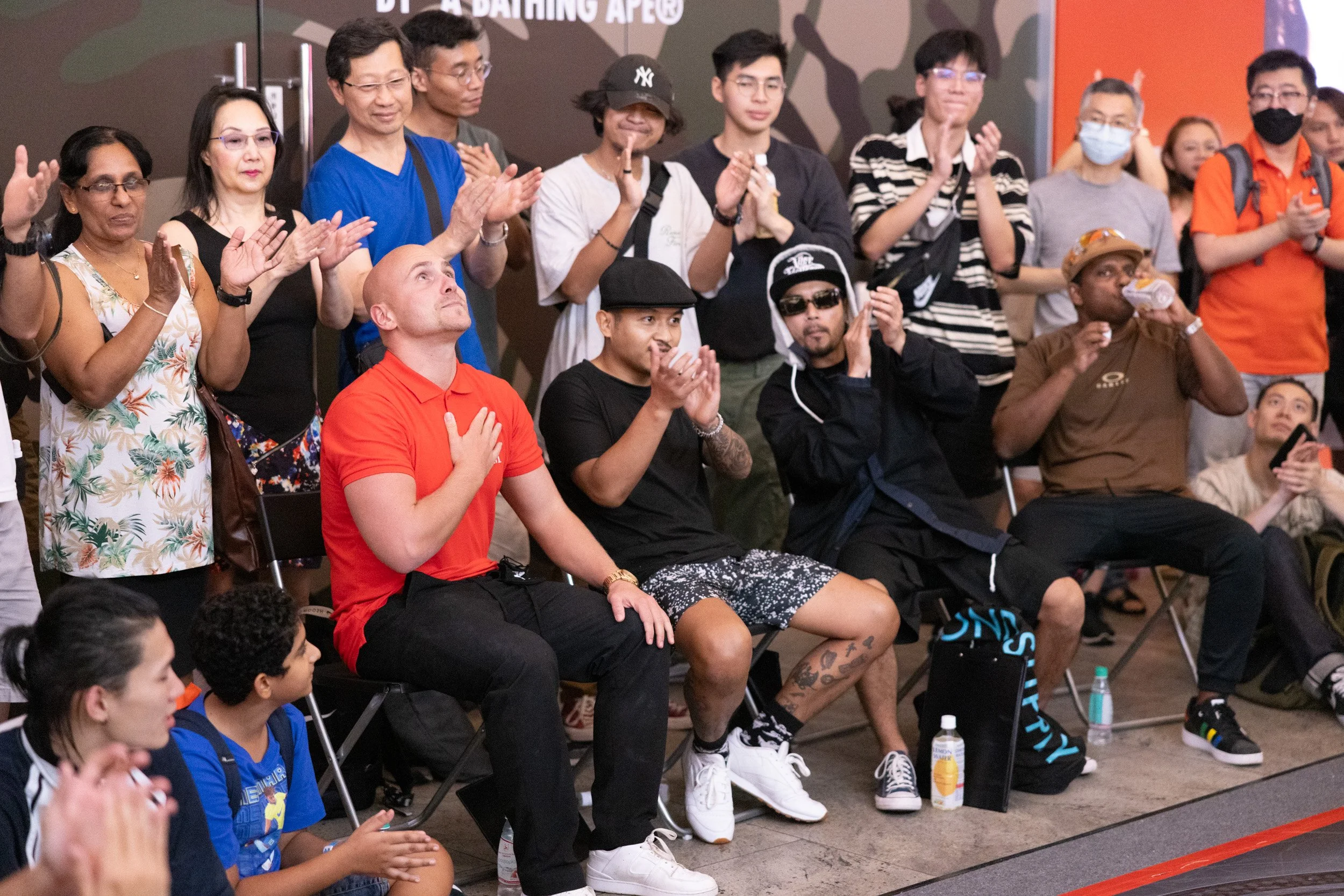  Competition judges applauding and reacting enthusiastically to a high-energy dance performance. 