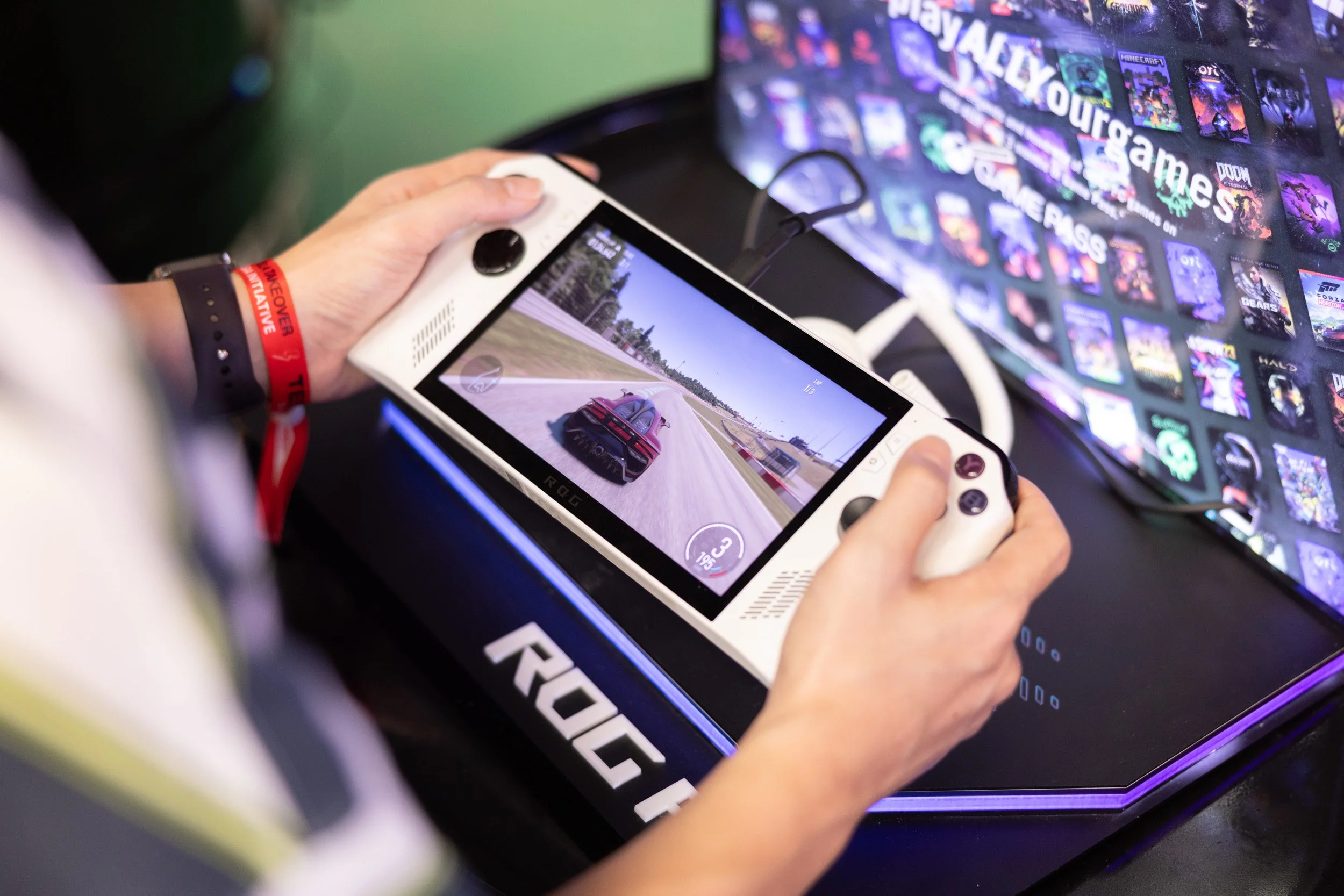  Detailed close-up of an ASUS ROG Ally handheld gaming device powered by AMD processors. 