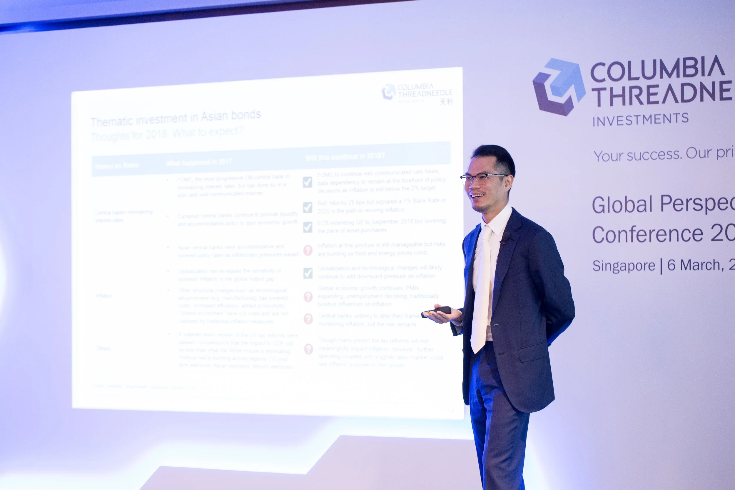  Medium shot of Clifford Lau speaking on stage during his keynote presentation. 