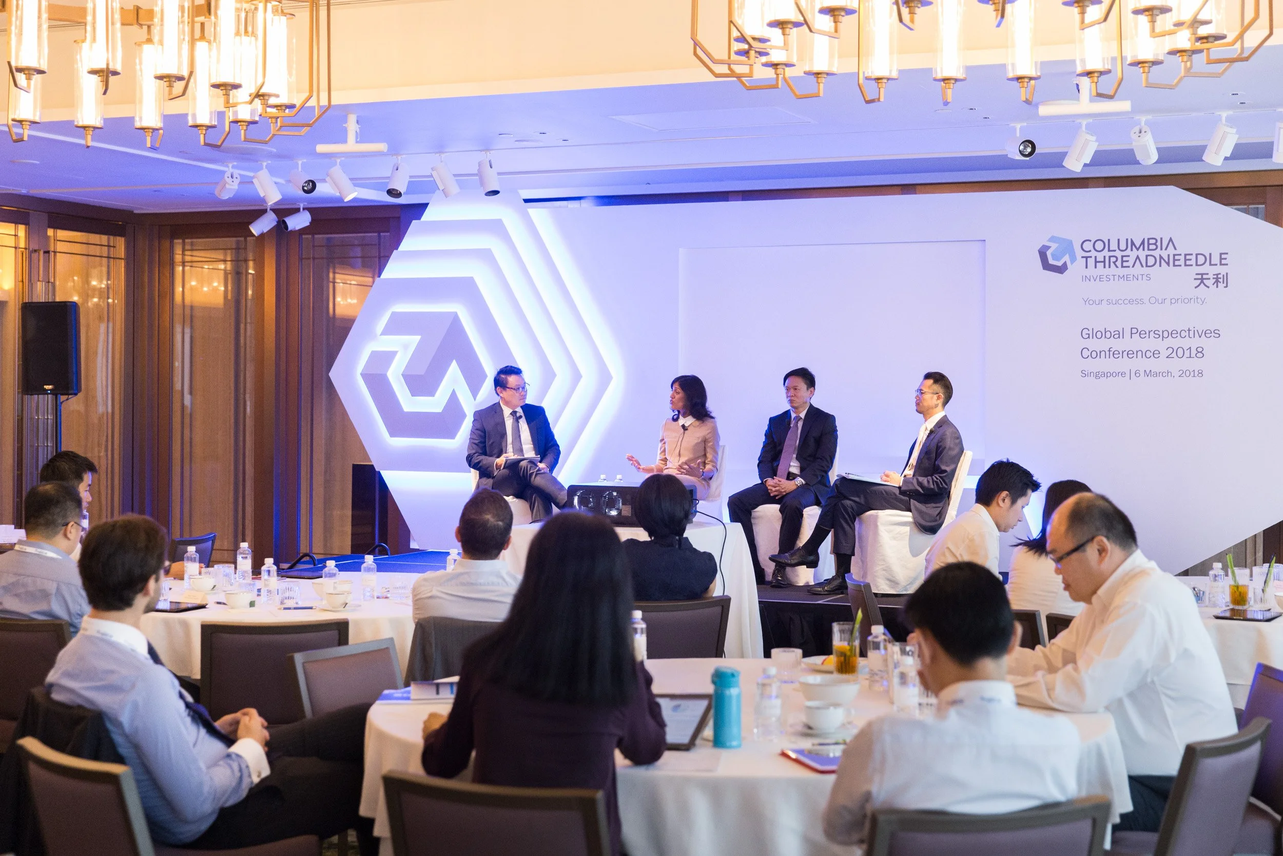  Panel discussion on stage during the Columbia Threadneedle Investments conference. 