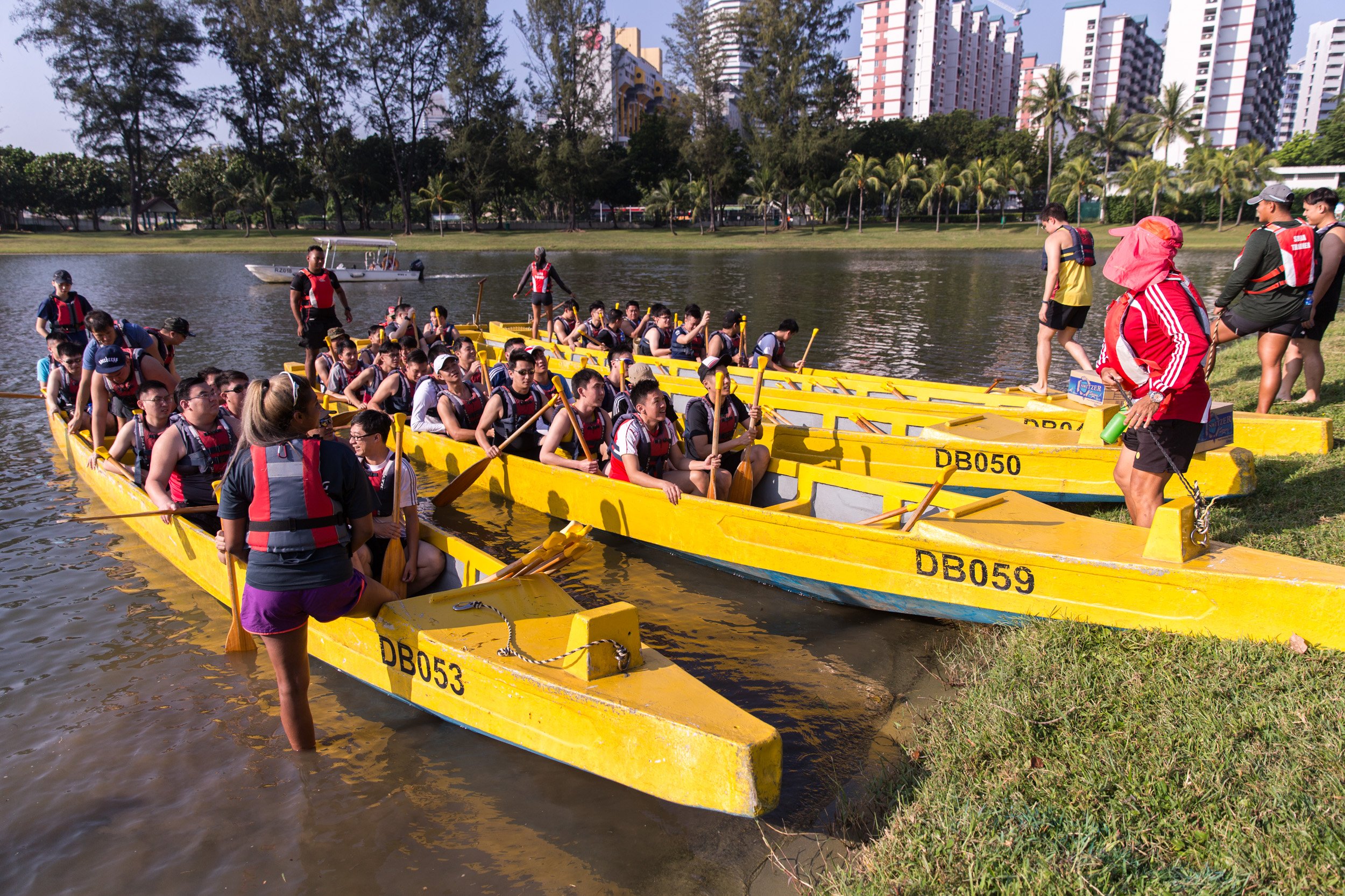  Three team dragon boats preparing to launch into Kallang Basin for the unit cohesion event. 
