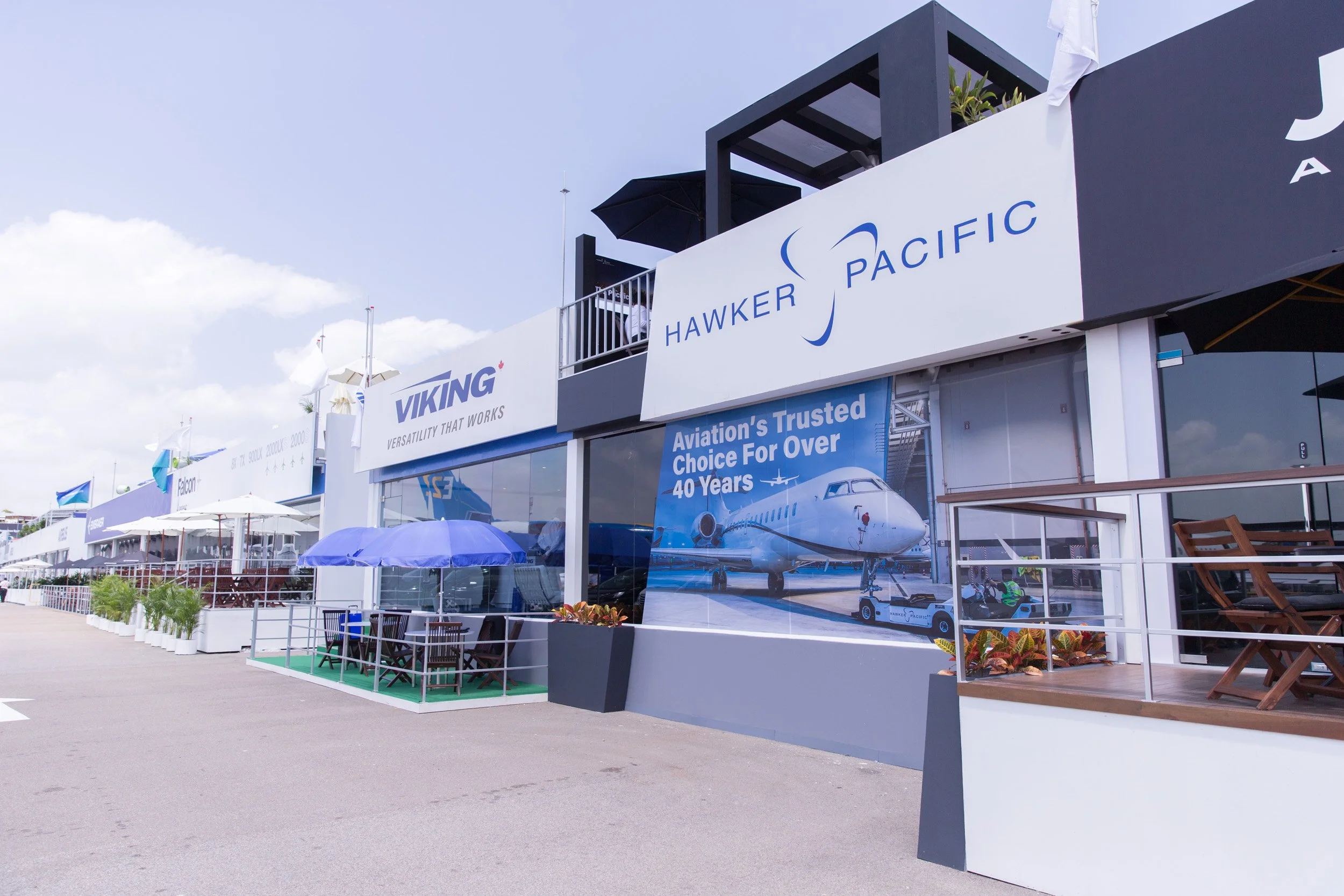  Alternative exterior angle showing Hawker Pacific logo branding and promotional window display graphics. 