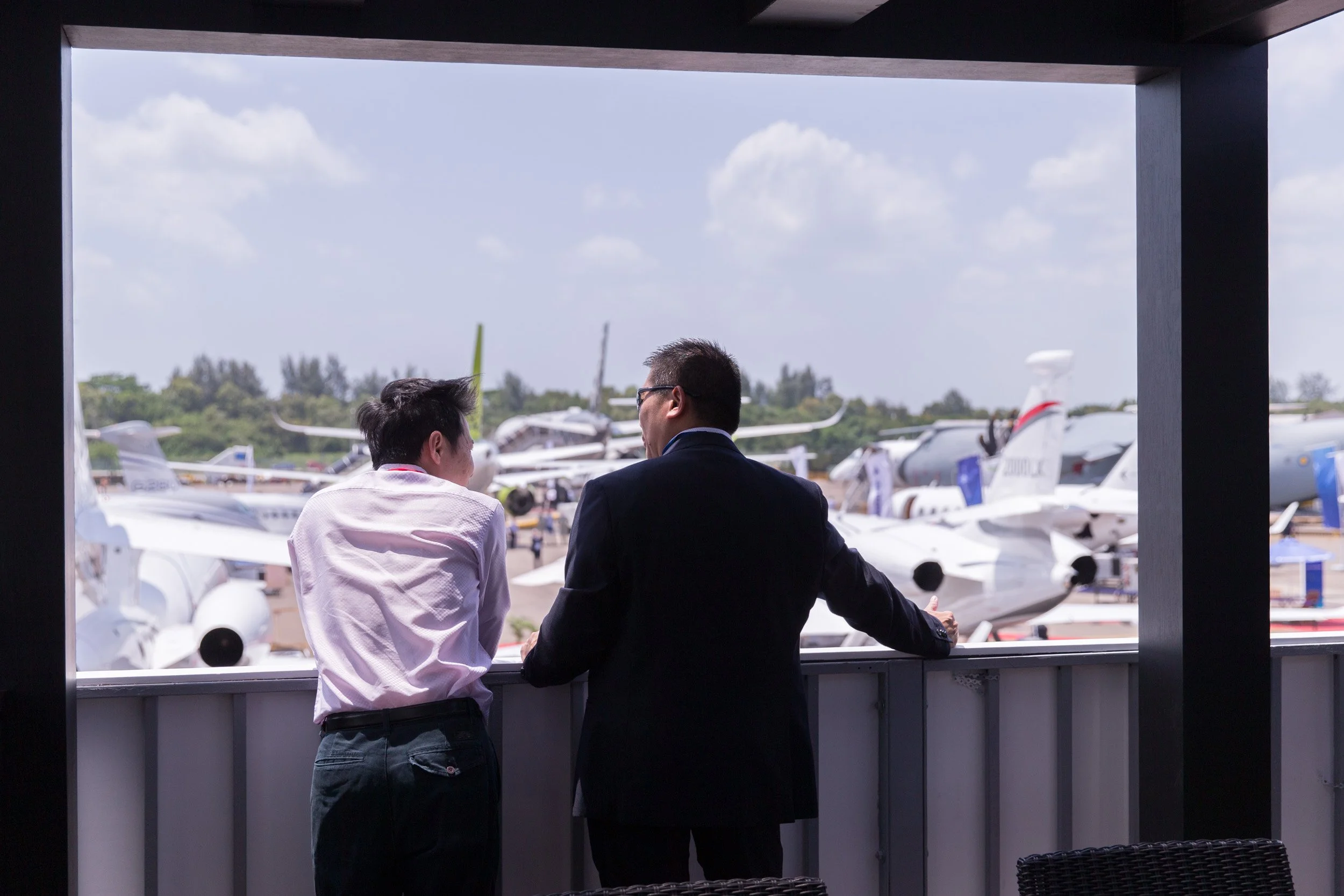  Corporate guests on the upper viewing deck of Hawker Pacific Chalet awaiting the RSAF aerial display. 
