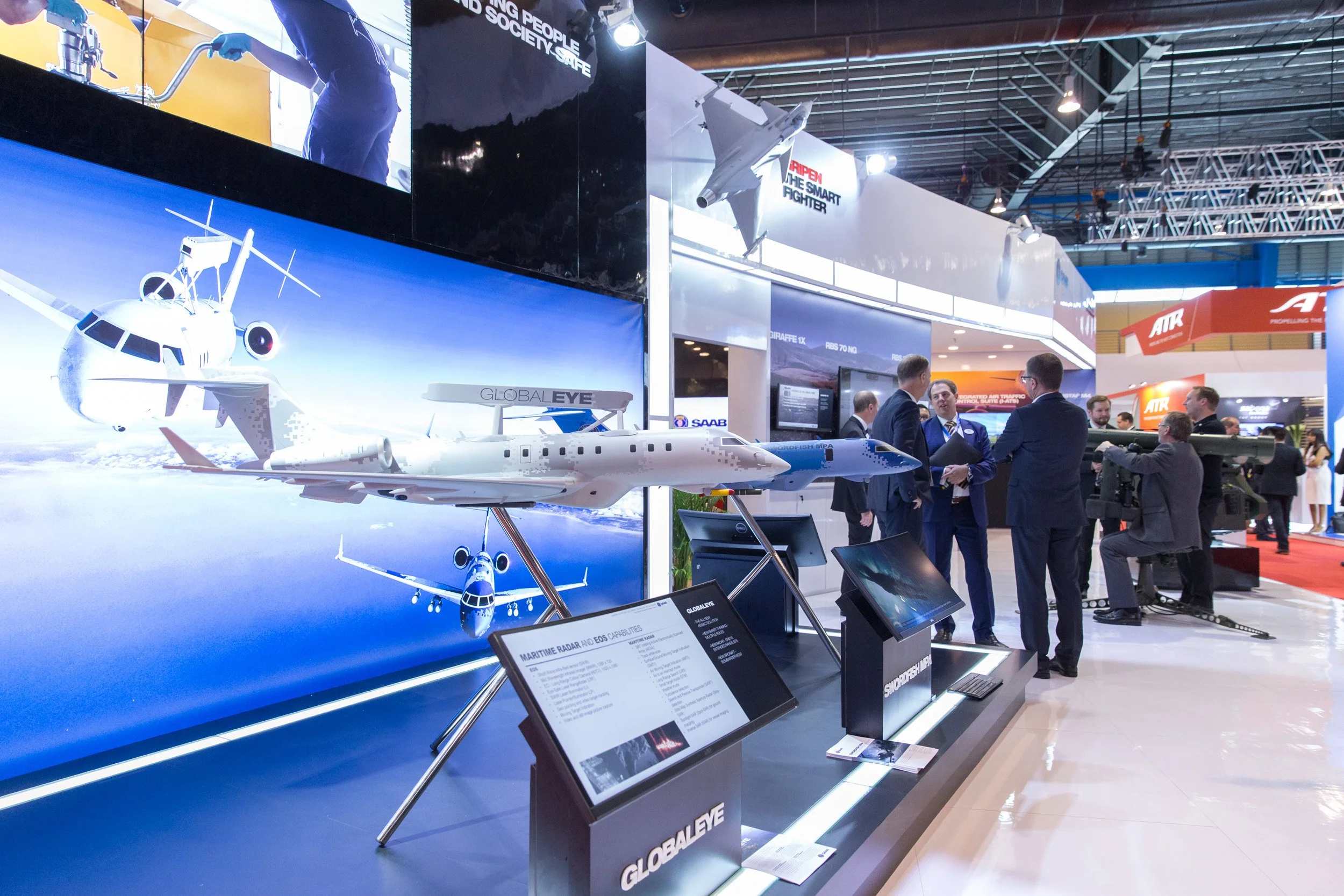  Detailed exhibition booth display featuring precision scale models of aircraft. 
