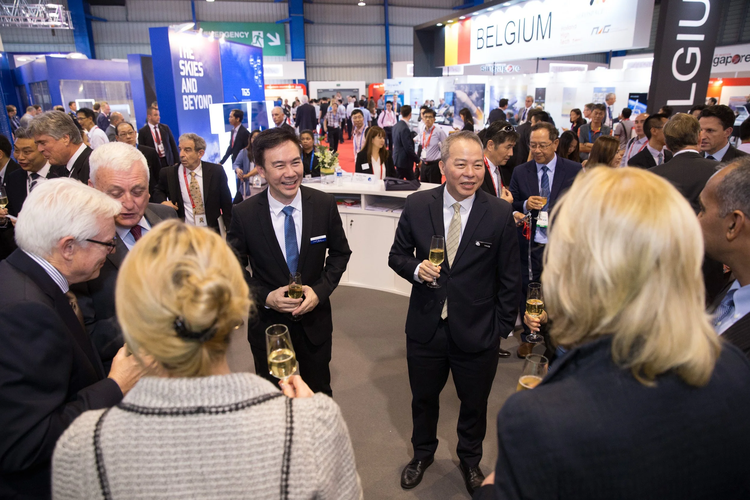  Hawker Pacific executive leadership networking with international delegates on the airshow exhibition floor. 