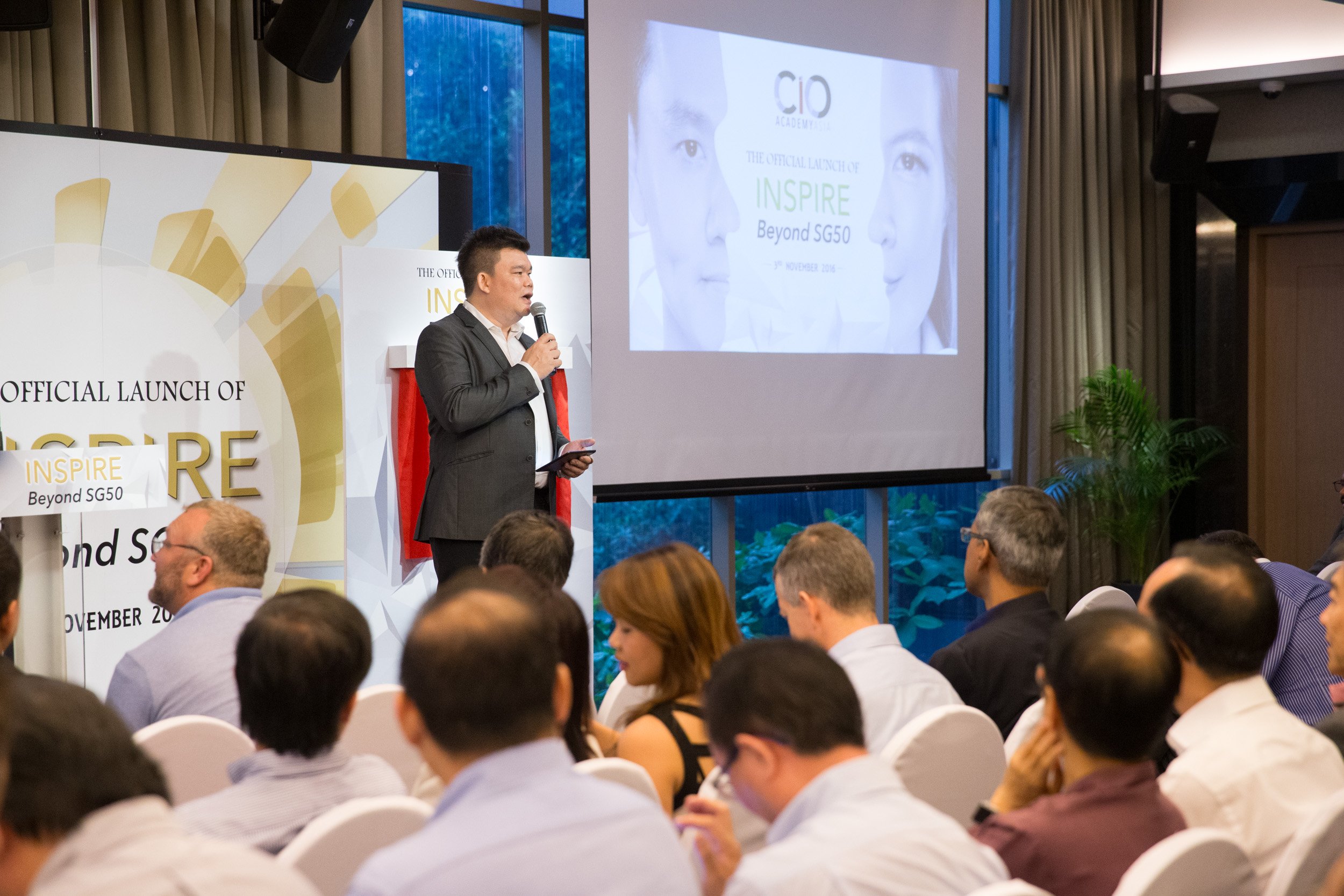  Event emcee introducing speakers and welcoming delegates to the Inspire Beyond SG50 official ceremony. 