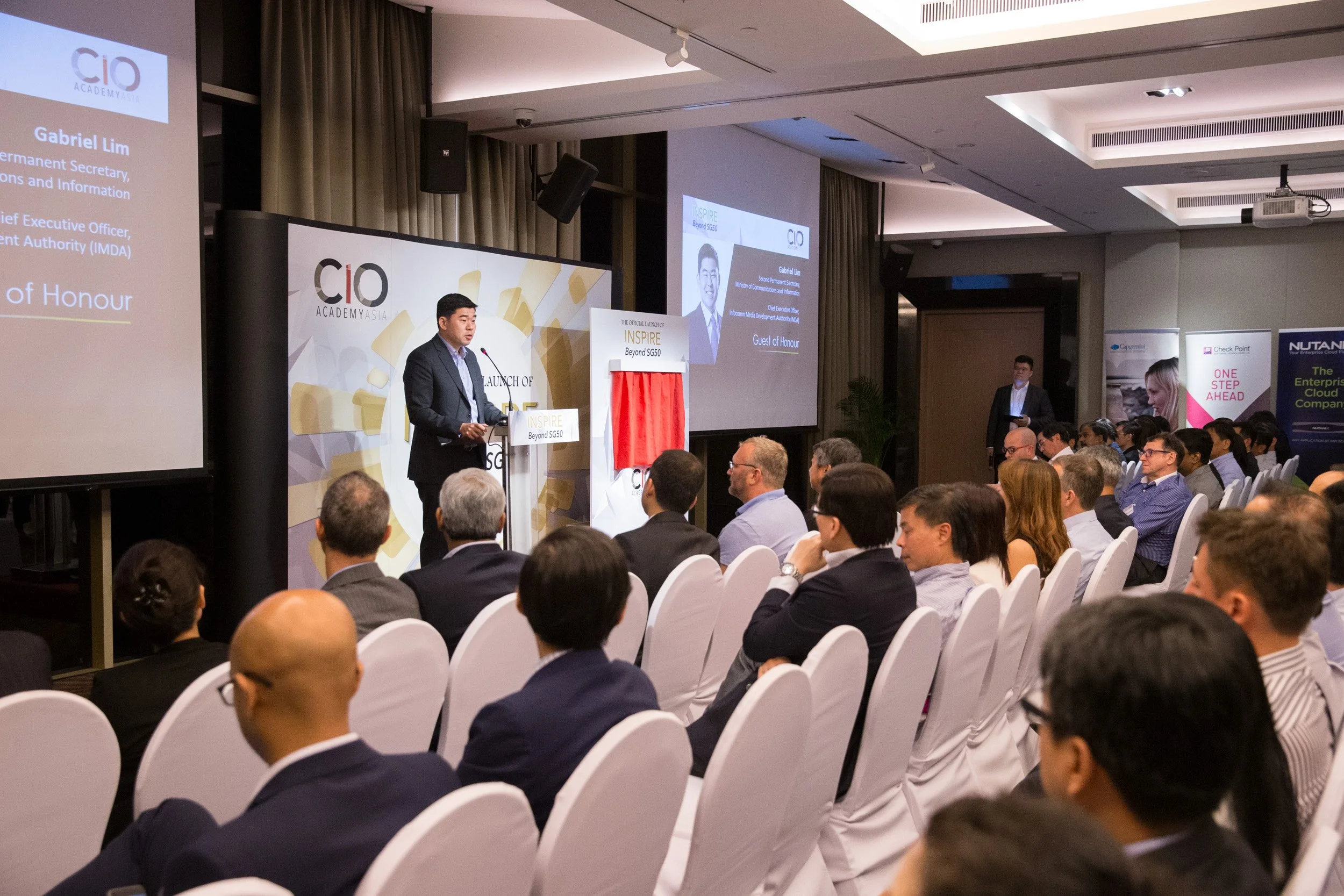  Wide perspective of Guest of Honor Gabriel Lim, Second Permanent Secretary MCI, delivering the opening address. 