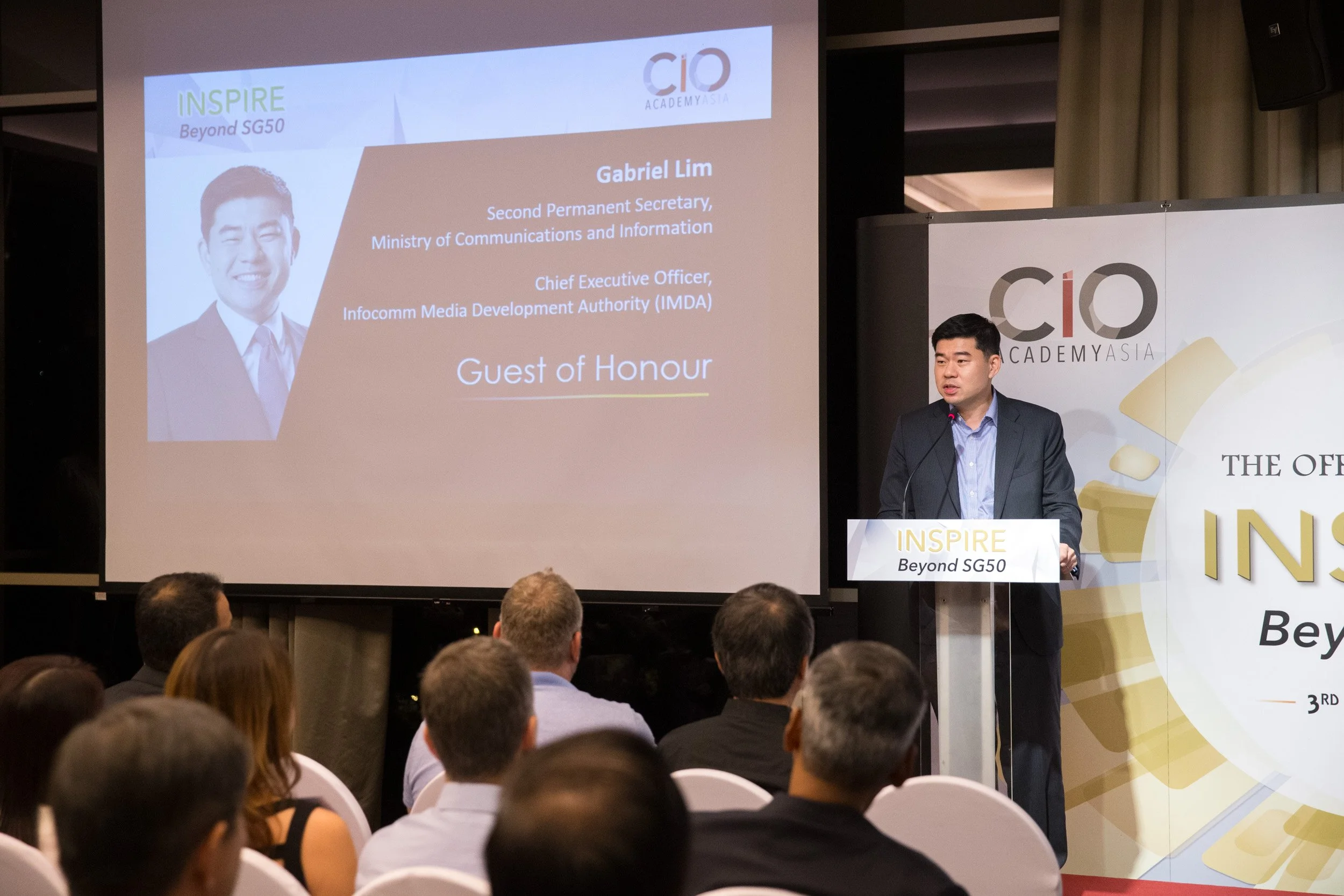 Medium shot of Guest of Honor Gabriel Lim addressing delegates during the book launch program. 