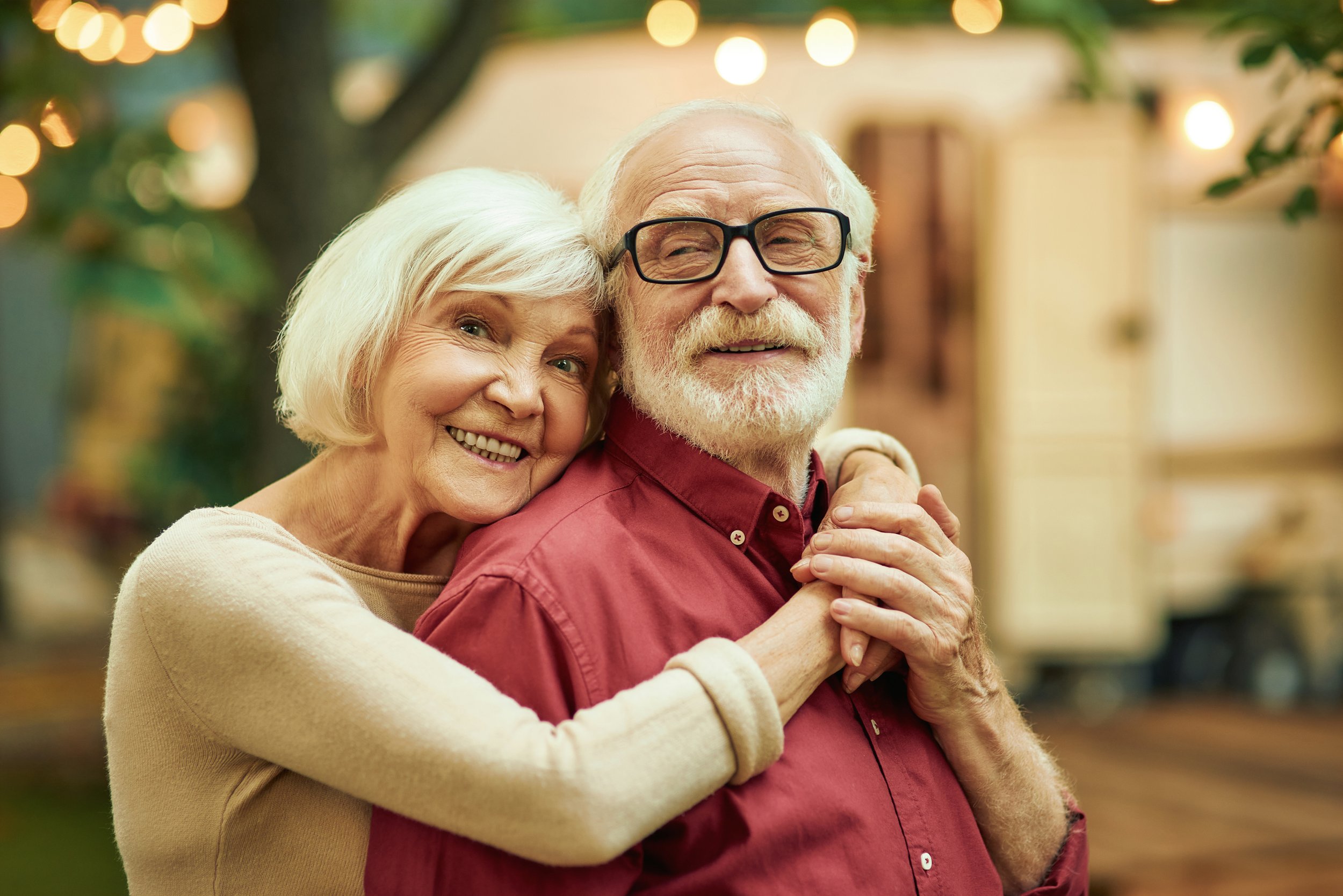 smiling-elderly-people-standing-near-their-motorho-2021-09-03-20-52-43-utc.jpg