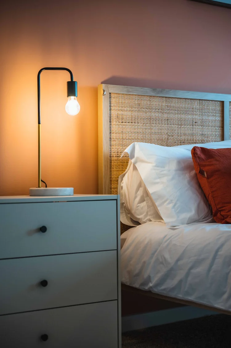 Bedroom with rattan headboard