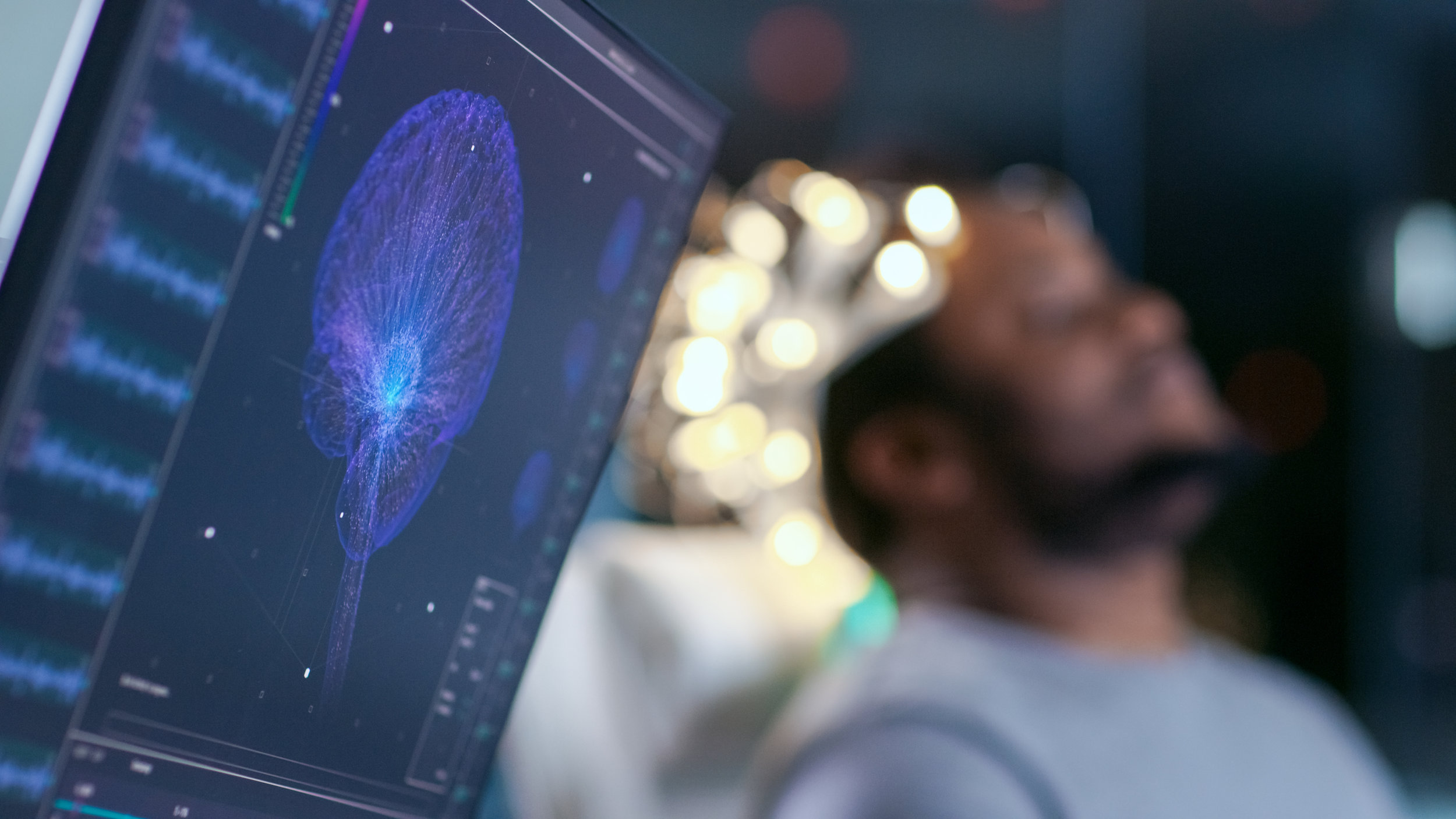 Monitors-Show-EEG-Reading-and-Graphical-Brain-Model.-In-the-Background-Laboratory-Man-Wearing-Brainwave-Scanning-Headset-Sits-in-a-Chair-with-Closed-Eyes.-In-the-Modern-Brain-Study-Research-Laboratory-925426264_5120x2880.jpeg