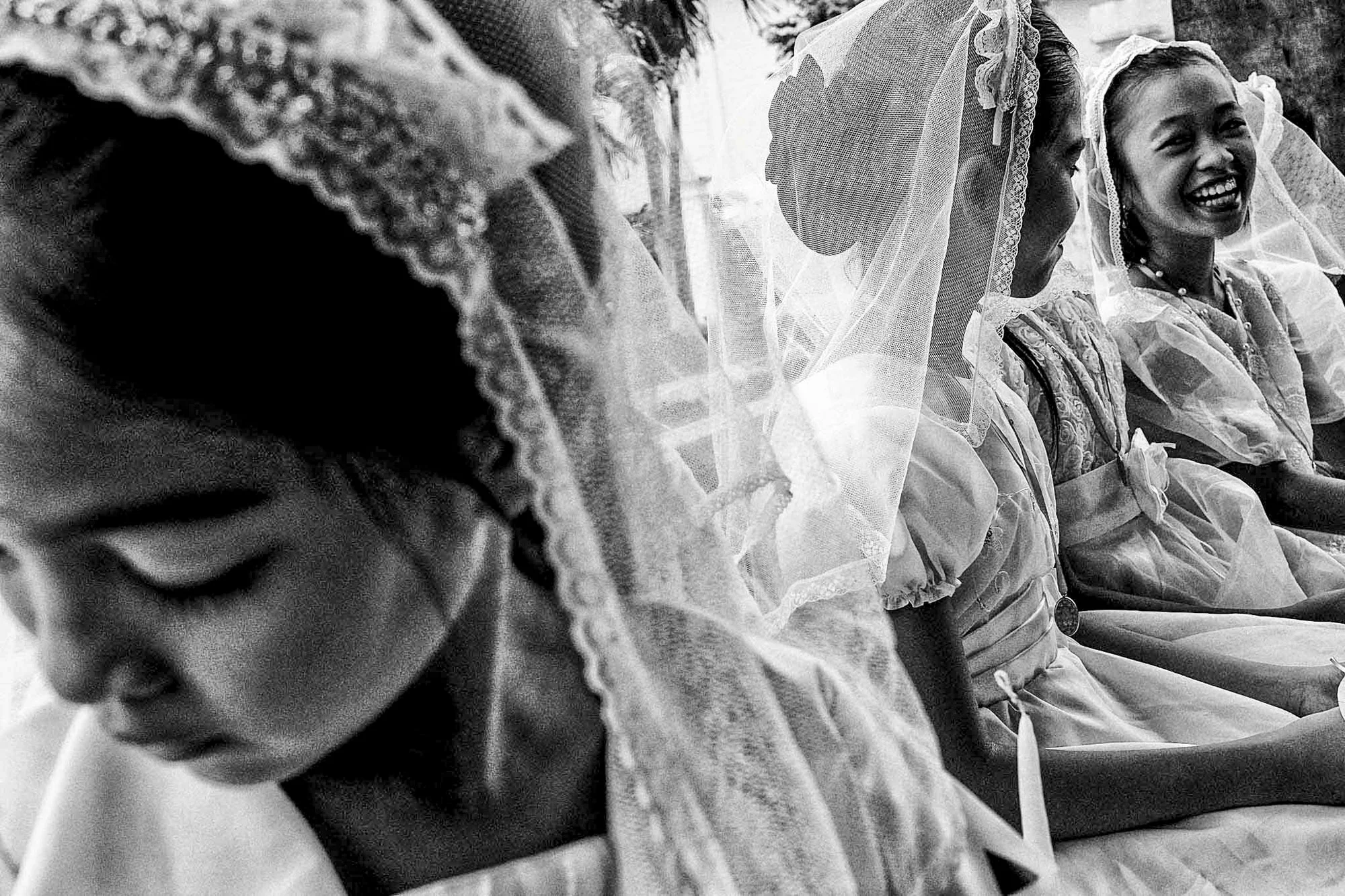 Catholic school girls await their first communion rights months after Typhoon Haiyan, the strongest typhoon ever recorded, wreaked havoc in the greater region of the central Philippines. © Veejay Villafranca