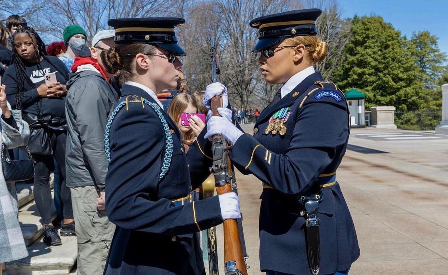 Pictured here is Sergeant Kamille Torres who just took her last walk at the Tomb of the Unknown Soldier. She is handing off her rifle to PFC Jessica Kwiatkowski, the newest female in the platoon. She is the first ever infantrywoman to serve at the To