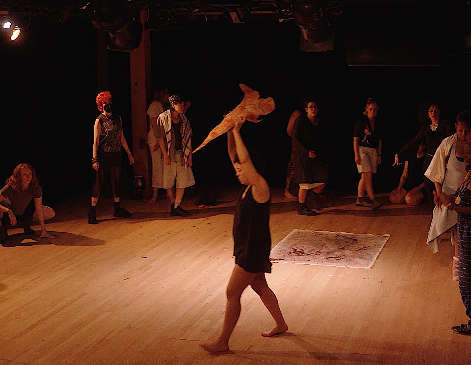 not a performance, 2025, 6 min, participatory performance with original writing as recorded sound, canvas, dirt, paper pulp figure, fabric Video still by Moty Margolin