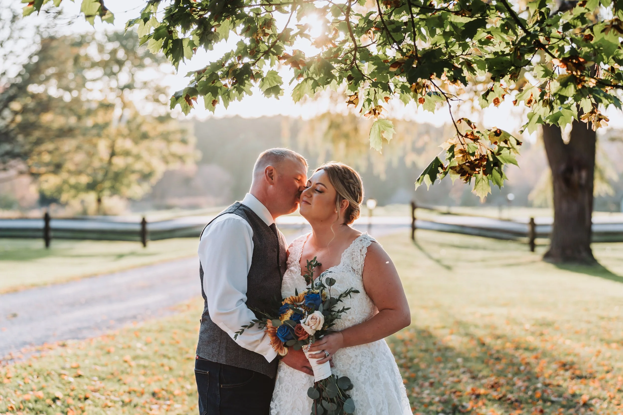 Documentary style wedding photography of a couple's sharing an intimate moment during golden hour at On The Ridge Events by Maple & Clover