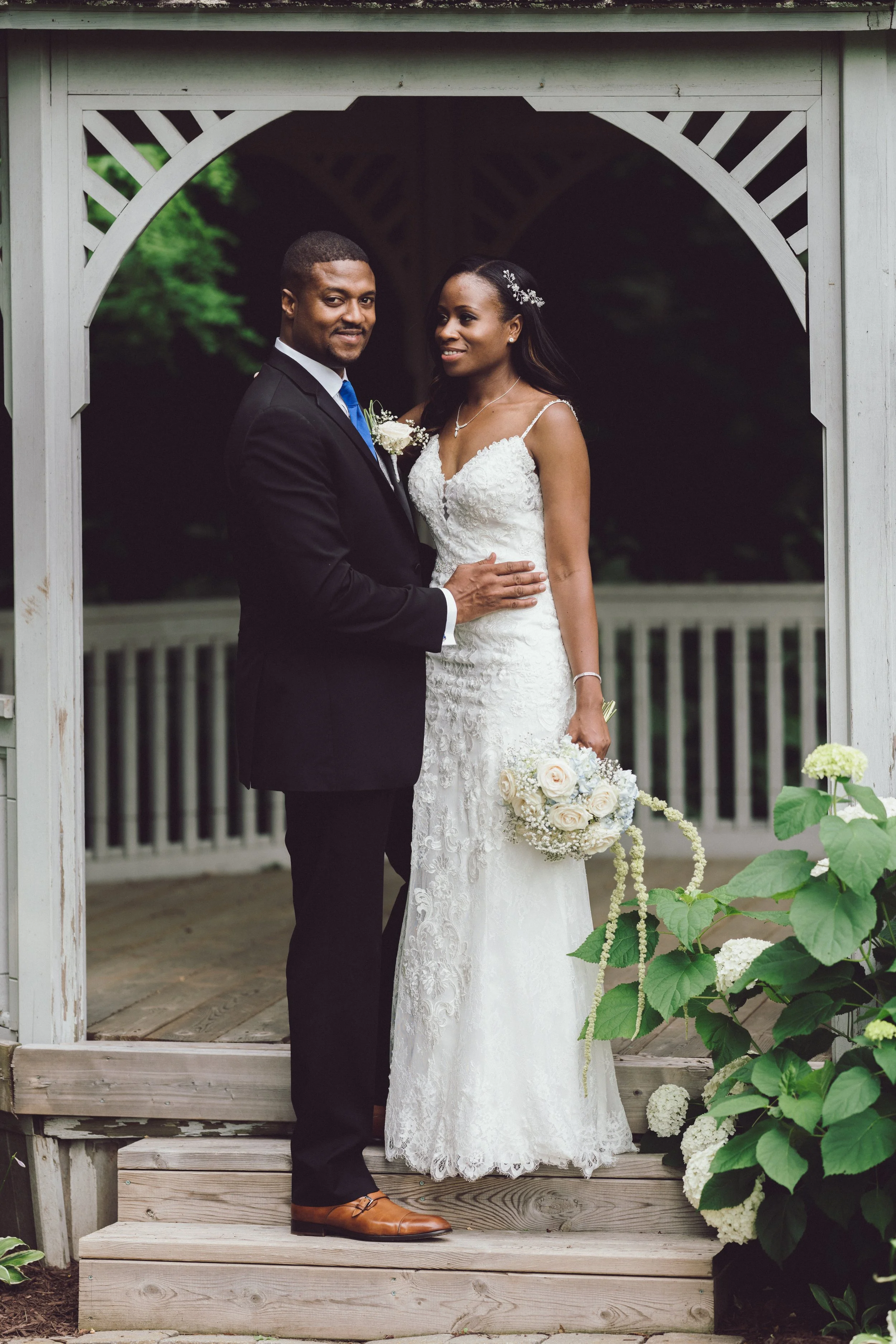 A bride and groom standing eloquently, enjoying the moment, captured by Maple & clover in Mississauga, with a documentary style. 