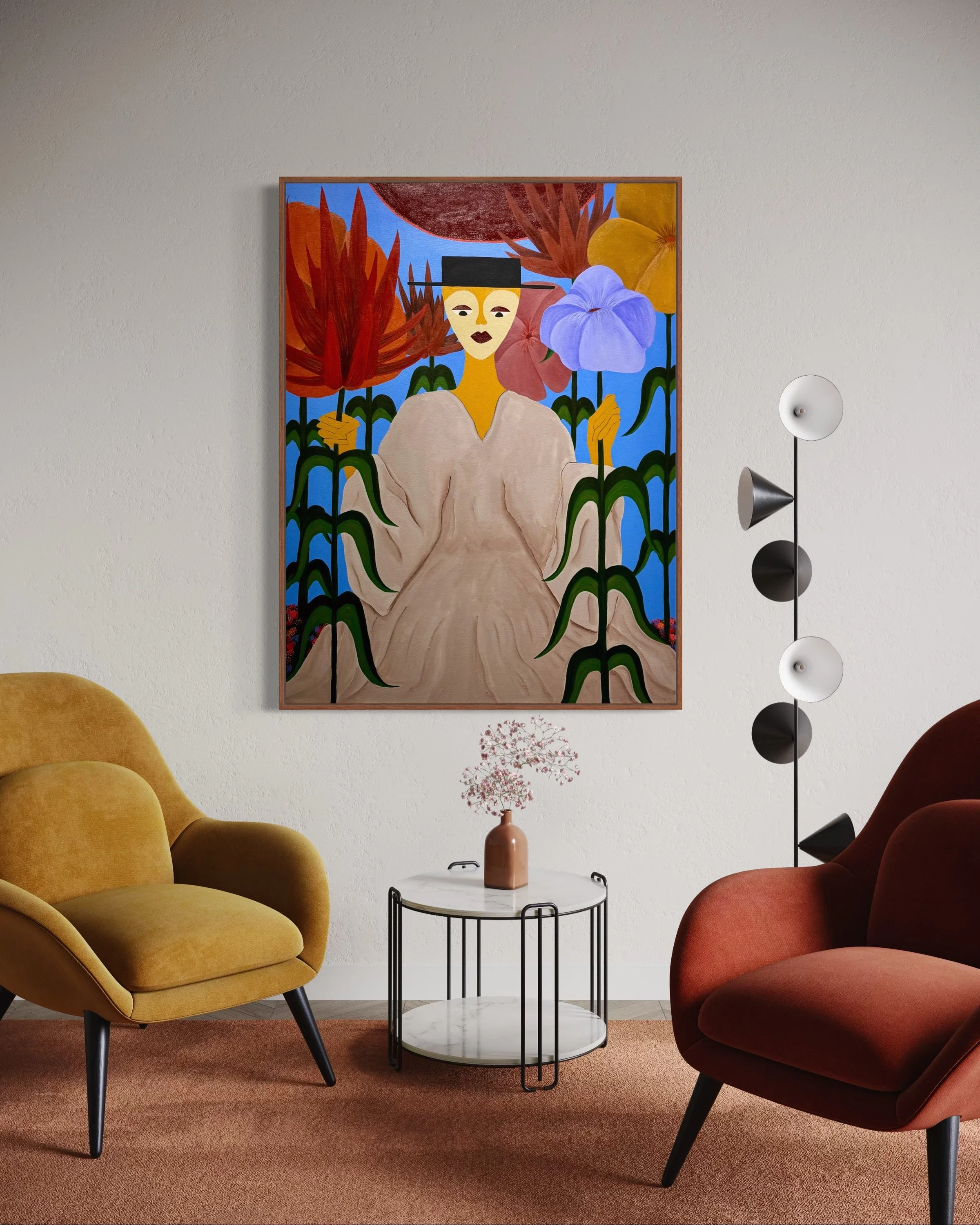 Living room with yellow and rust-colored armchairs, a white marble-top side table with a pink vase and pink flowers, a wall-mounted art piece featuring a woman with a black hat surrounded by colorful flowers, and a modern floor lamp with three spheri