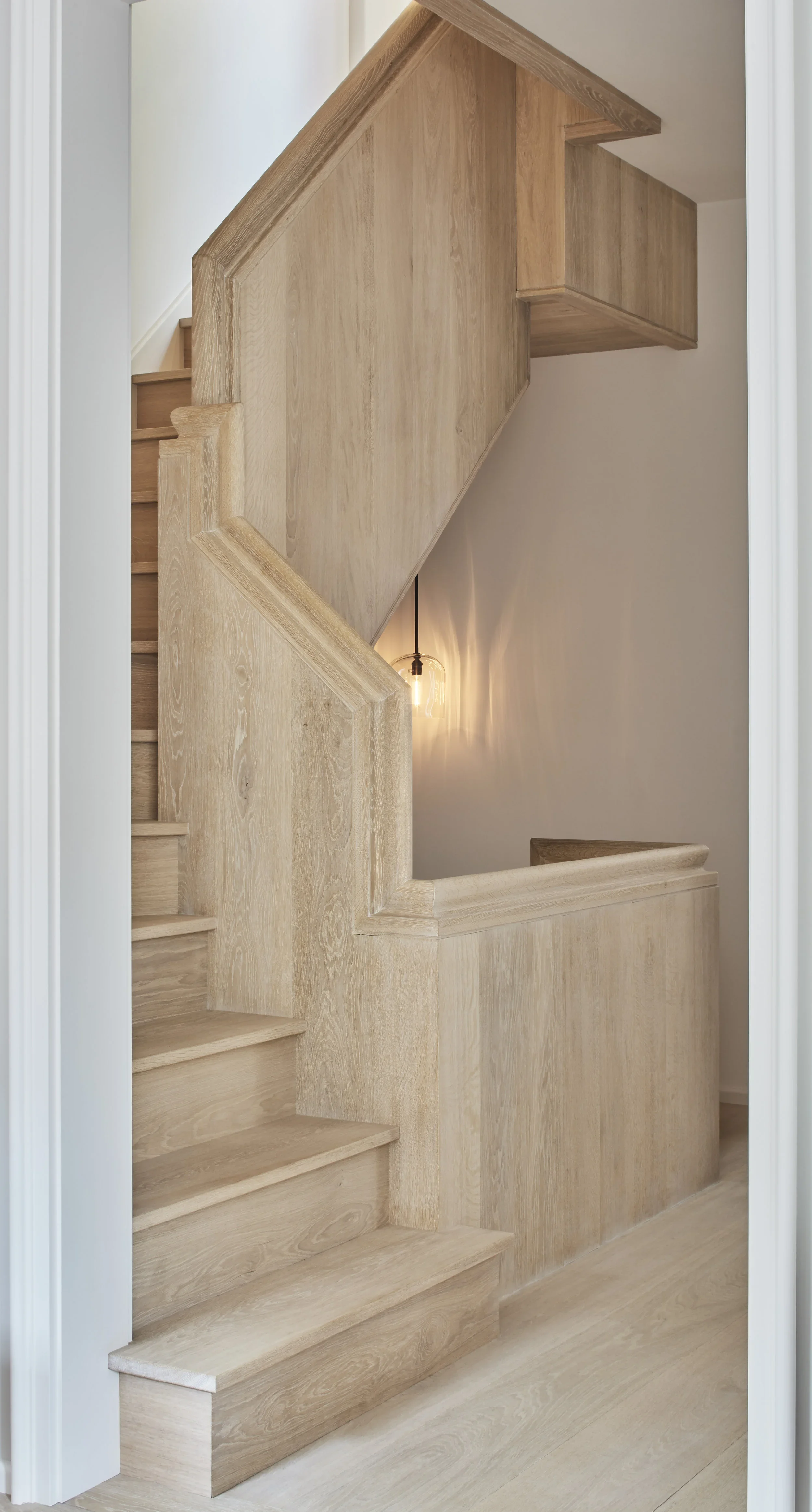 Whole-home renovation in Beacon Hill, Boston, with a continuous white oak stair joining six floors.