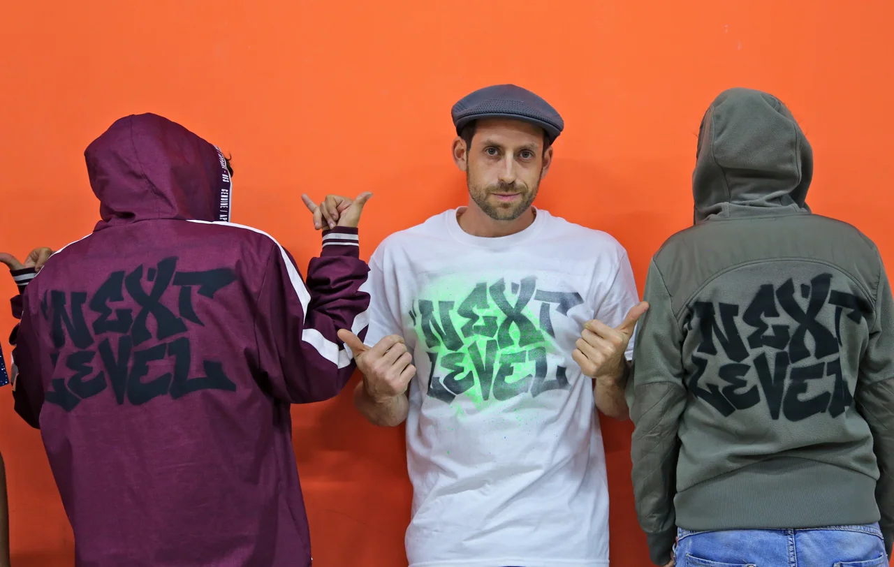Eric and his students with the NL logo put on the t-shirt.jpg