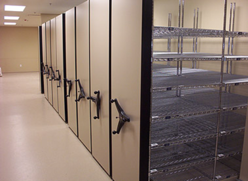 Mobile shelving system on rail carriage, closed configuration.png