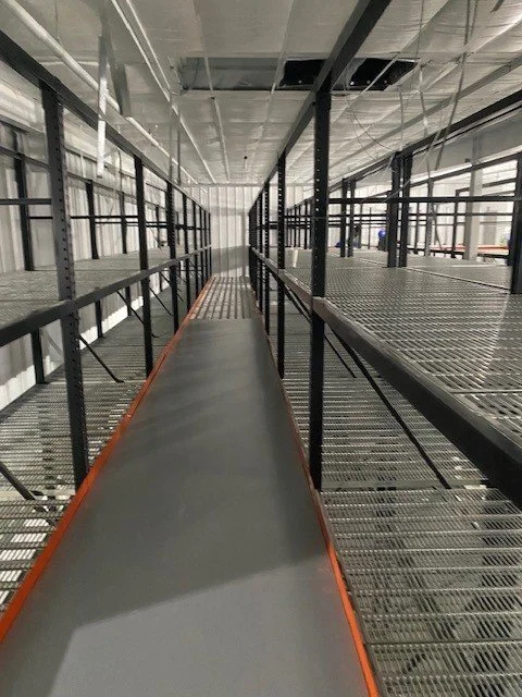 Industrial mezzanine platform with safety railing.jpg