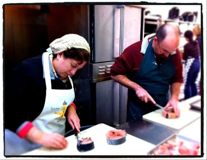 SFS board member, Patricia Eddy and her husband, John Eddy - both of cooklocal.com - breaking down tuna steaks.