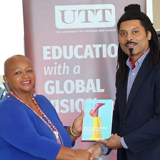 Jessel Brizan Donates Book to UTT Libraries
