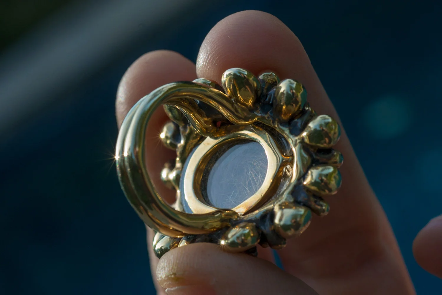Scarab ring with a lock of the client’s granddaughter’s hair embedded in the back