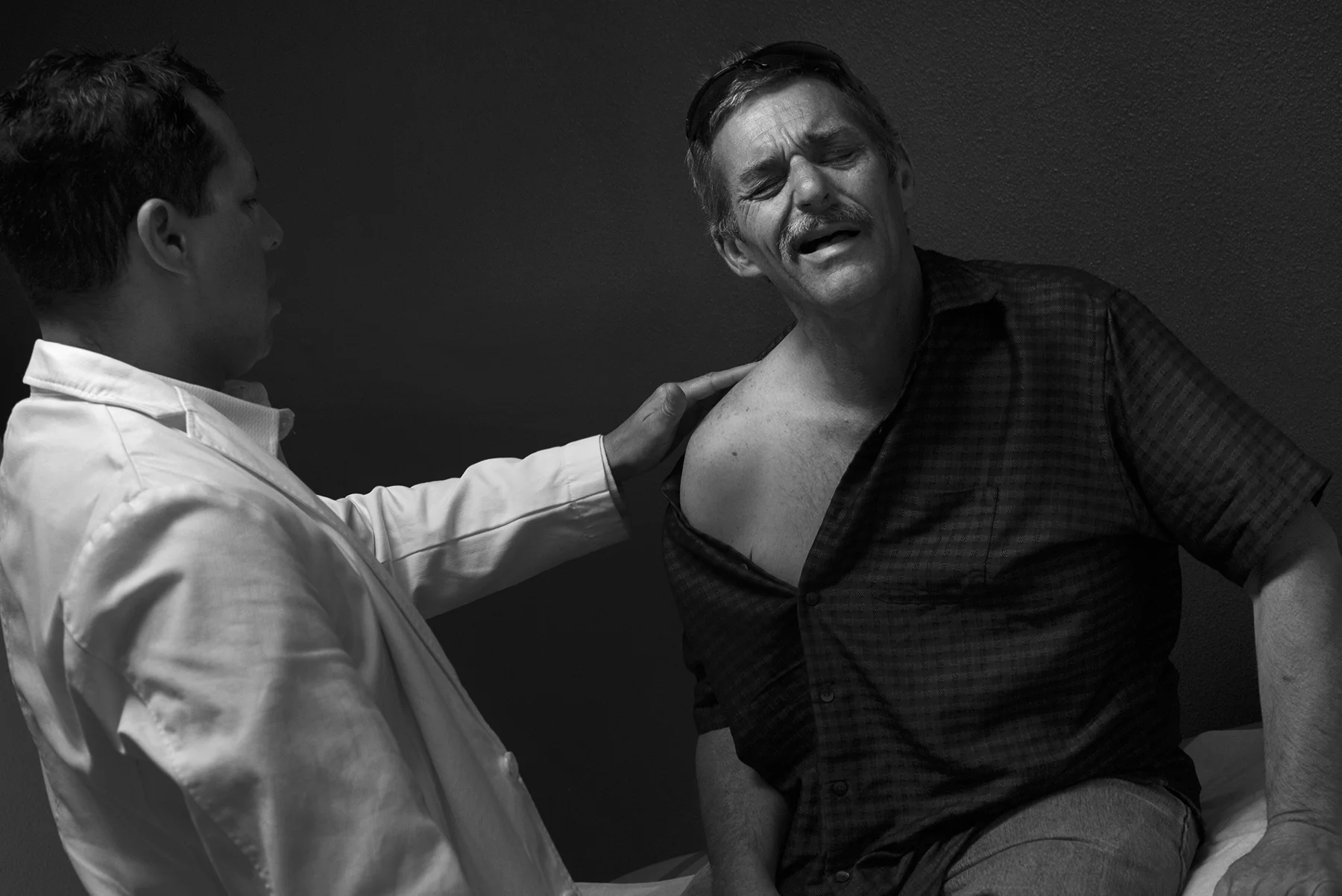 "I'm hurting bad and I can't work right now, I can't do nothing," Steve says during an examination of his injured right shoulder by Physician Assistant Luis Garcia. Steve tore a rotator cuff trying to build a platform in the mud. April 30, 2017.