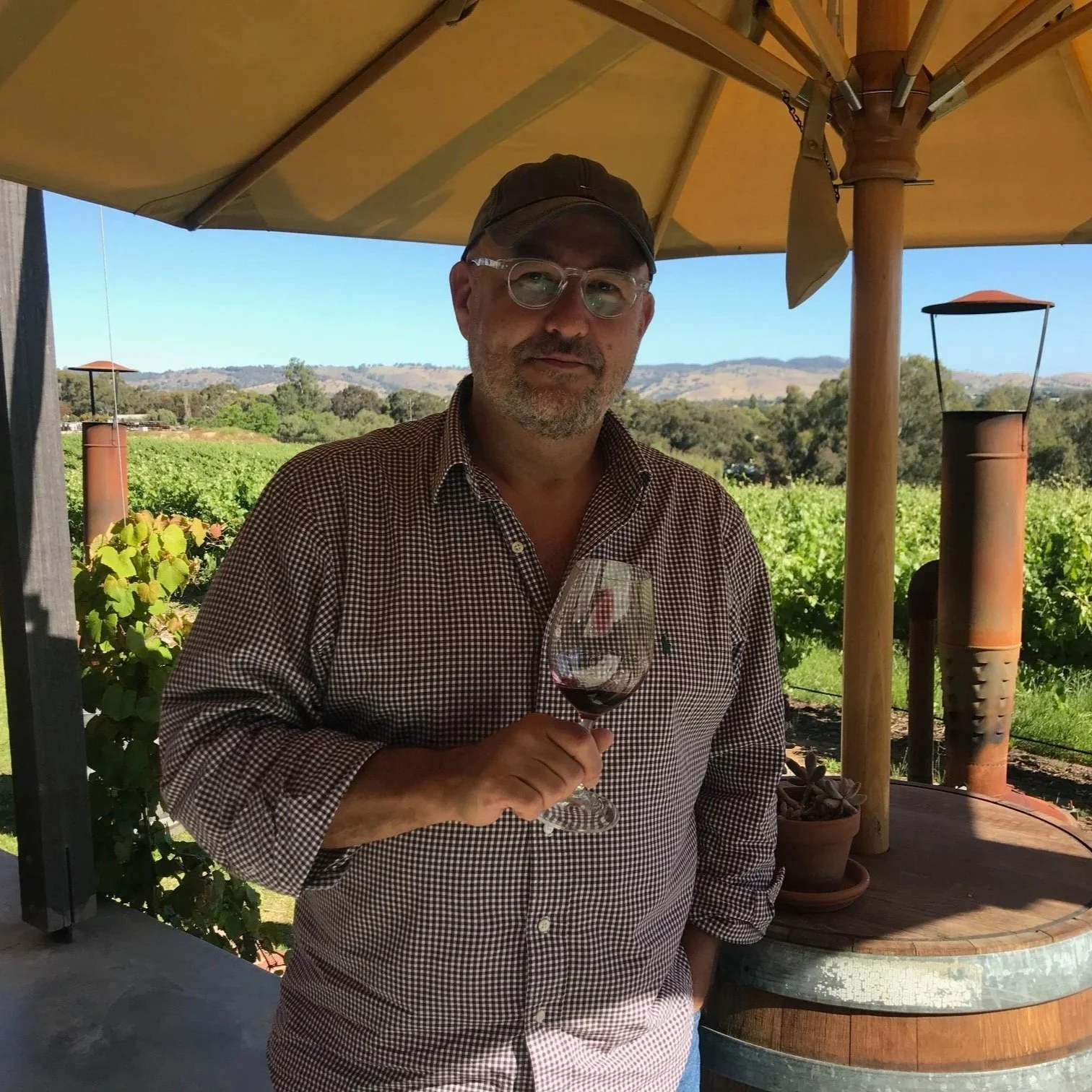 An image of Mike standing outside at a winery looking at the camera