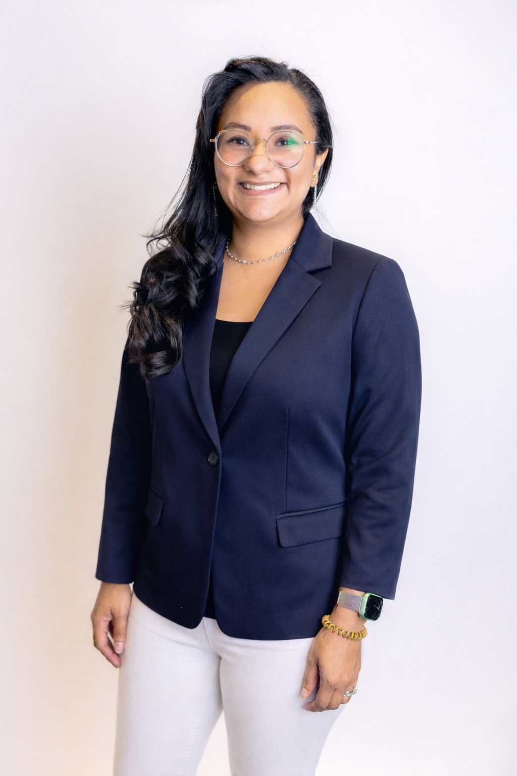 Professional portrait of Carolina DeLeon, supporting Process Improvement Partners in helping manufacturing organizations achieve Lean transformation, Kaizen success, and sustainable results.
