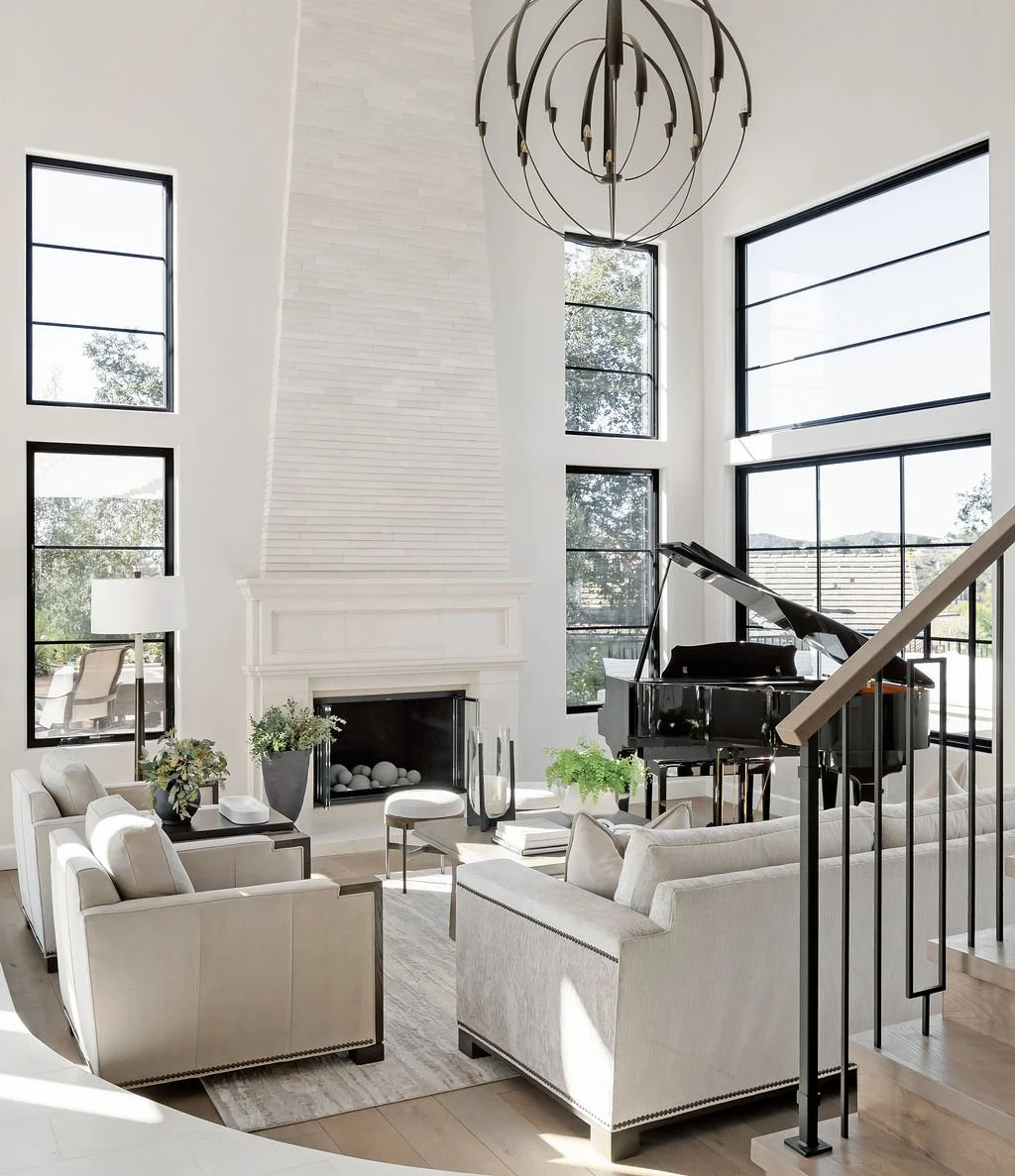 Lounge area with high ceilings and a grand piano