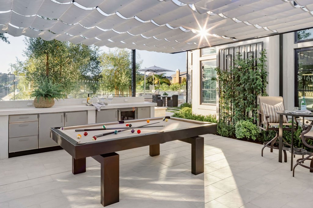 Pool table outdoor with a roof