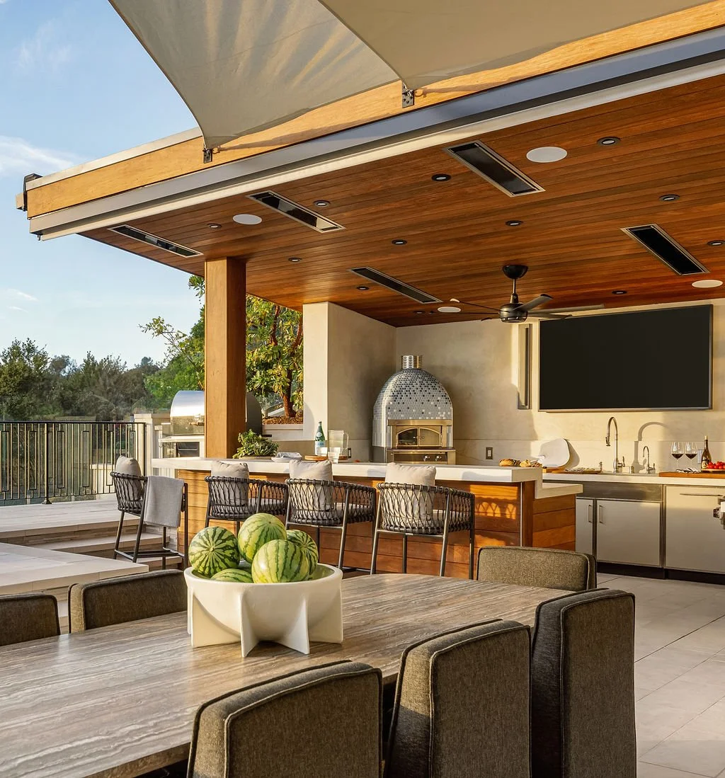 Outdoor kitchen and dining area with roofing