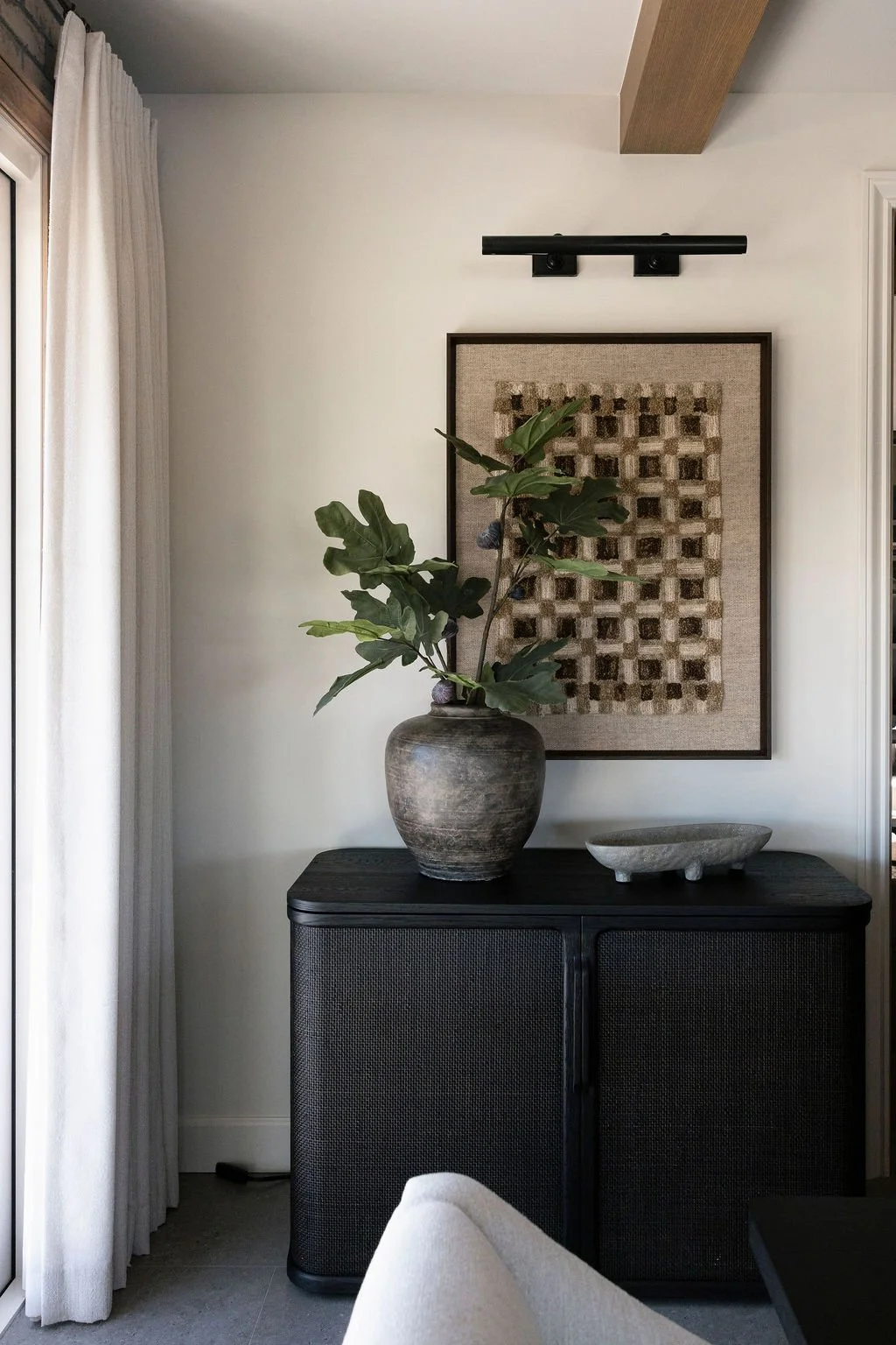 Plant on a dark cabinet