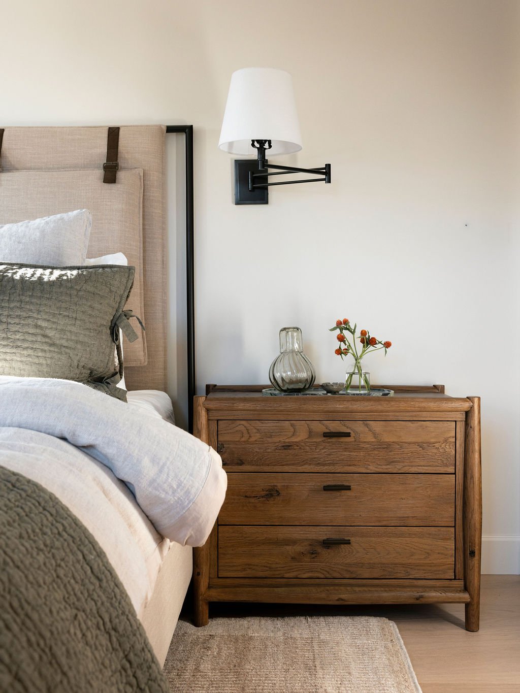 Bed and wooden sidetable