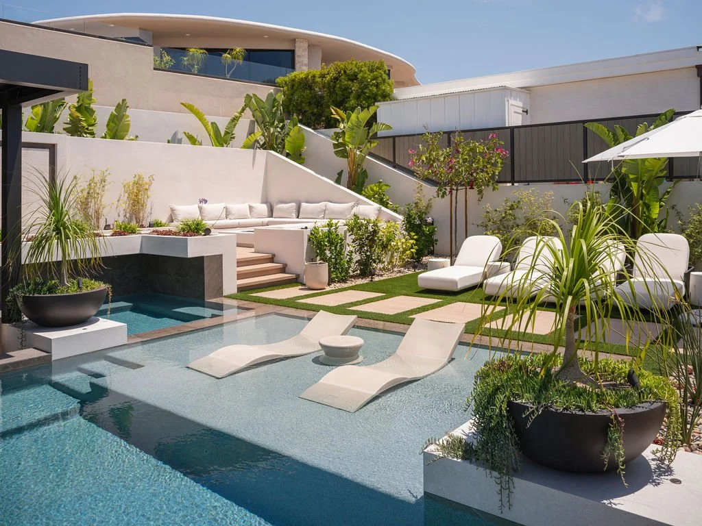 Elegant outdoor area with pool and lots of plants