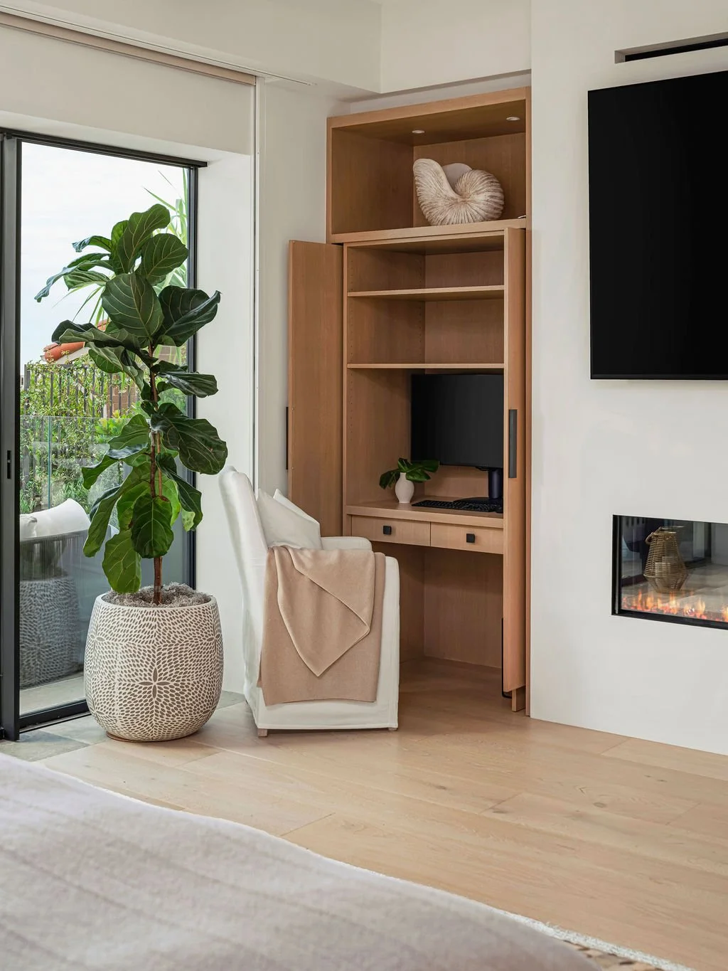 Nook area with a chair and plant