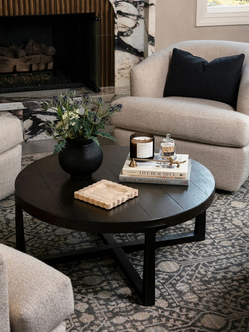Coffee table on detailed rug