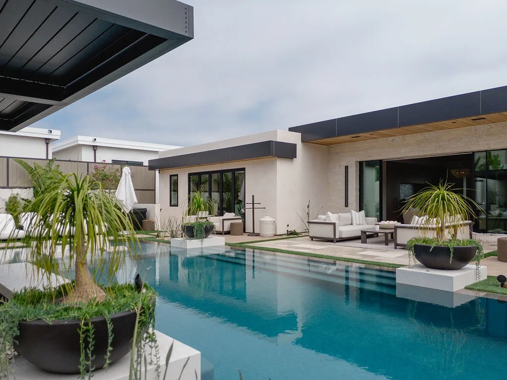 Pool just outside a luxurious home