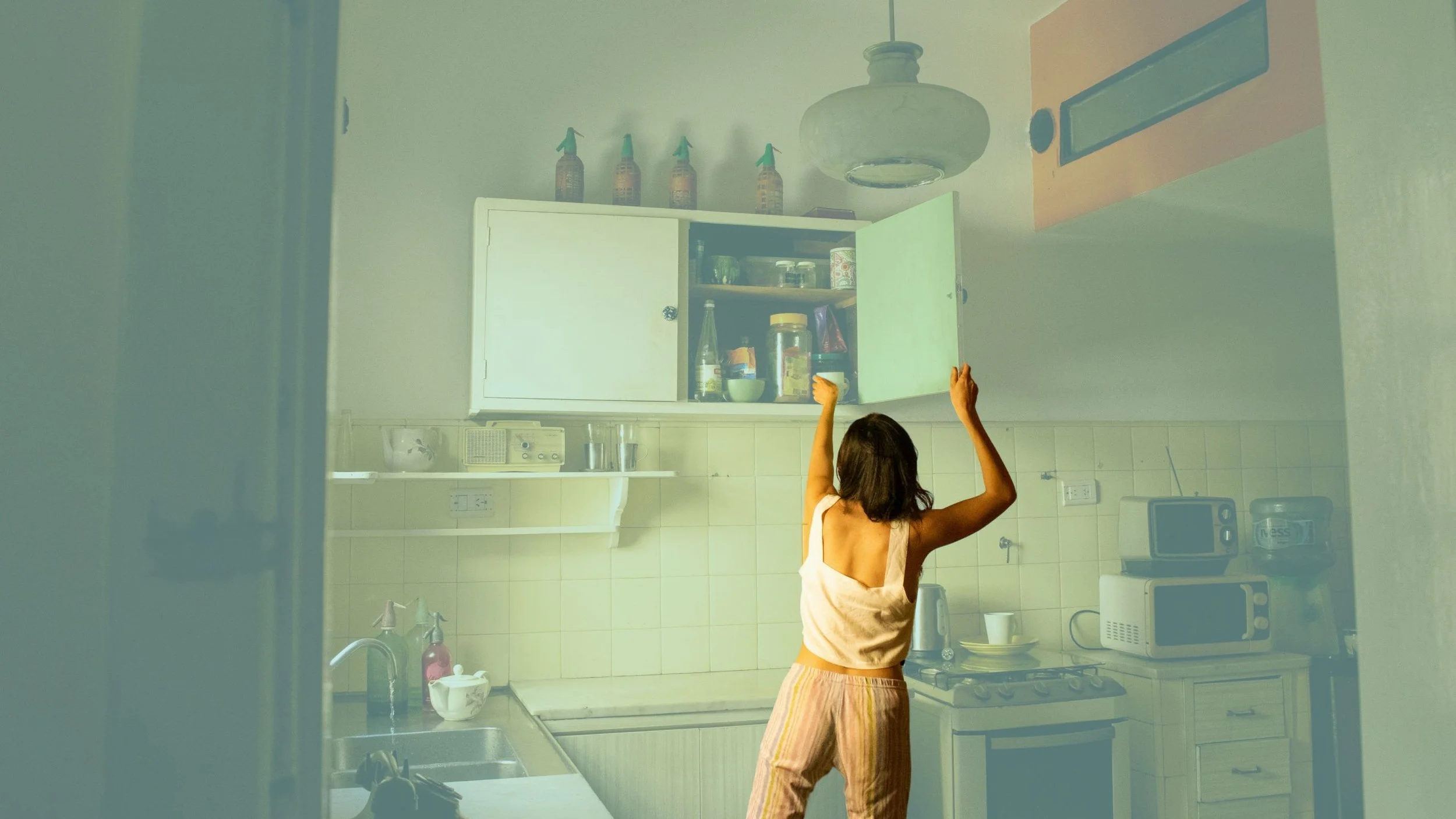 reaching_for_top_shelf