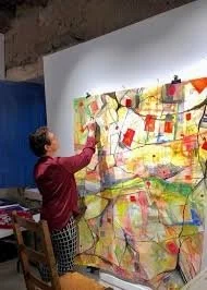 Sandra Charlap works on a painting.