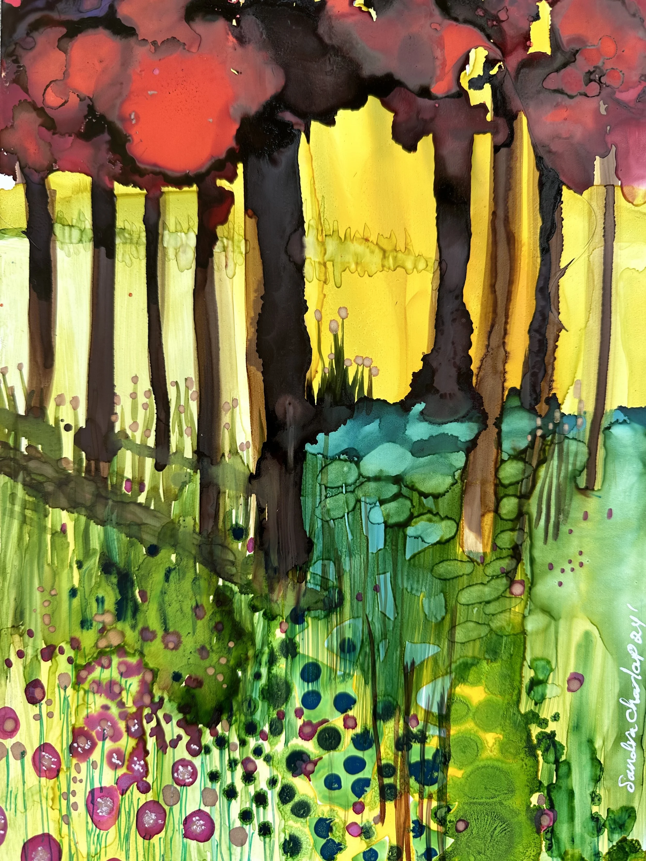 Red trees on a yellow sky with green grass.