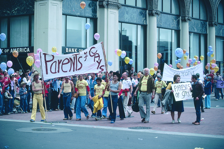  People marching with "Parents of Gays" signs, Gay Freedom Day Parade, 1980; photograph by Crawford Barton, Crawford Barton Papers (1993-11), GLBT Historical Society. 
