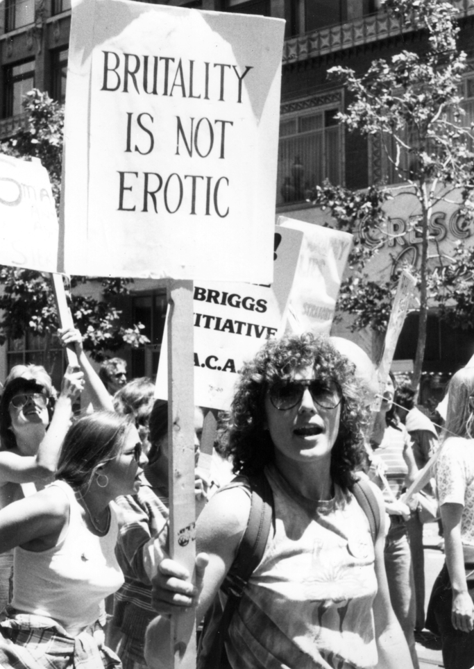  Person holding sign that reads "Brutality is Not Erotic,” Gay Freedom Day Parade, 1978; photograph by Elaine Gay Jarvis; Elaine Gay Jarvis Papers (2018-90), GLBT Historical Society. 