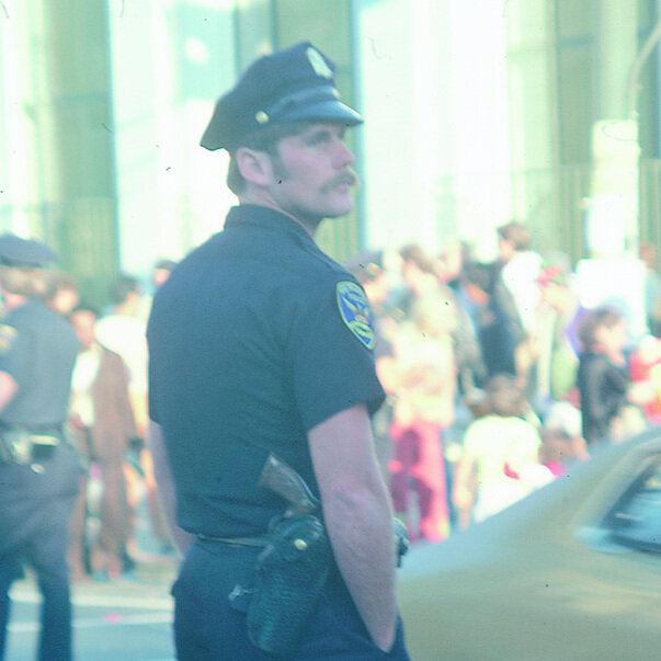 Officer observing 1977 Castro Street Fair