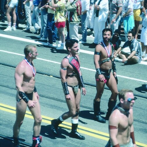 Leathermen walking in 1986 Pride
