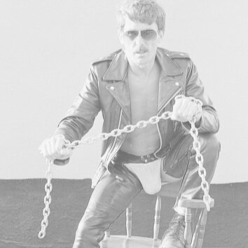 Man in leather jacket and chaps